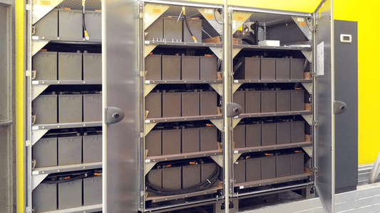 Typical industrial UPS system with battery cabinets (left) and main control unit (right), providing backup power to protect control hardware during power outages.